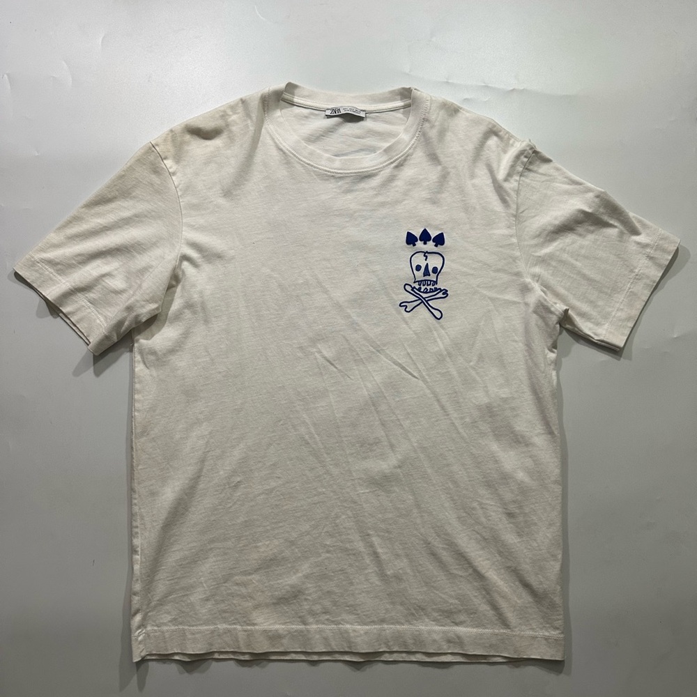 Cream T-Shirt with Blue Skull Design